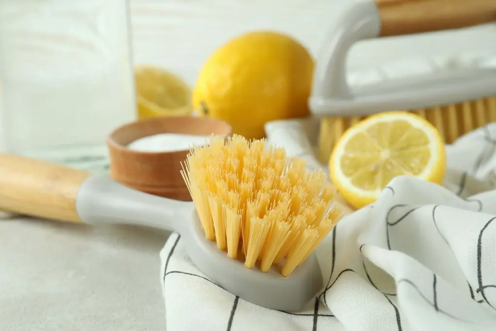 Natural cleaning brush and lemon on a kitchen worktop, Cleaning With Meaning Maidstone