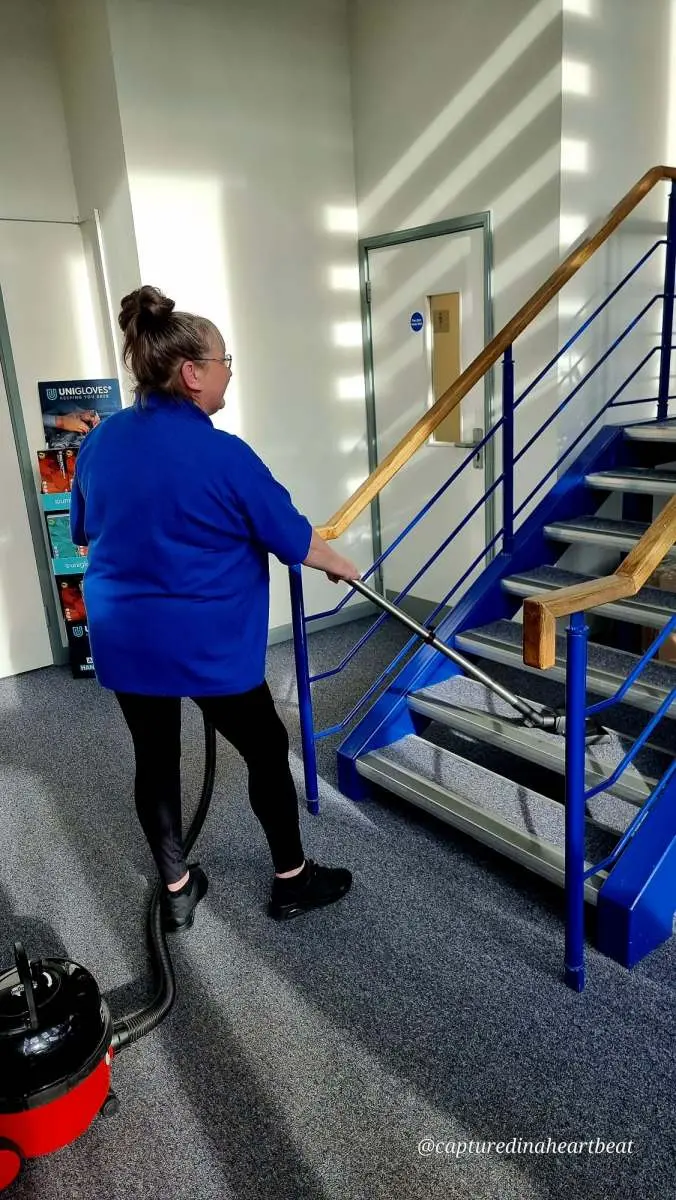 Cleaning With Meaning cleaner vacuuming office stairs in Maidstone