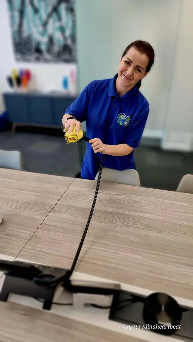 Cleaning With Meaning cleaner polishing a dining table in Maidstone
